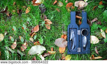 Sommelier Set For Opening Wine Bottles. Gift Set For A Sommelier On A Background Of Grass And Autumn