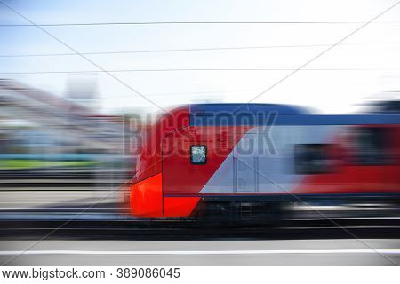 A Modern High-speed Train Moves Along The Platform. Motion Blur