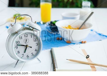 Morning Habits. Day Planning And Healthy Eating. Time For Breakfast. Alarm Clock With Healthy Food A