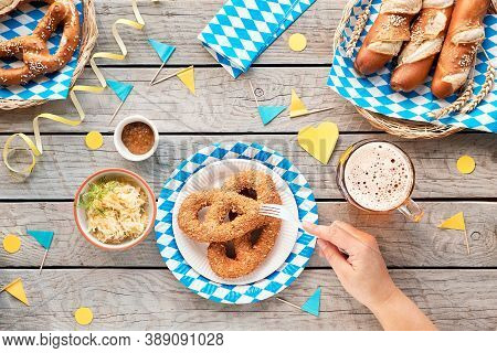 Oktoberfest Traditional Food, Top View On Garden Wooden Table With Blue White Decorations