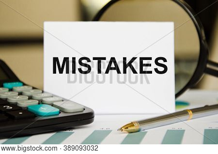 Word Mistakes Is Written On A White Sheet Of Paper Bumaki Near The Calculator. Mistakes In Business 