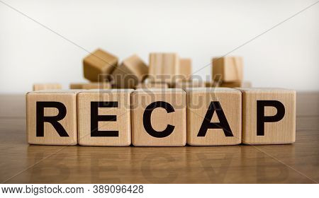 The Word 'recap' On Wooden Cubes On Beautiful Wooden Table, White Background, Copy Space. Business C