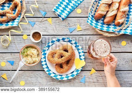 Oktoberfest Traditional Food, Top View On Wooden Table With Blue White Decorations