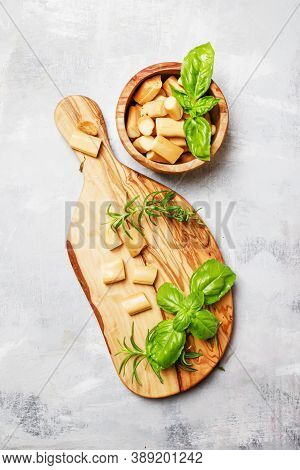 Traditional Smoked Chechil Cheese In Bowl And Cutting Board, Top View