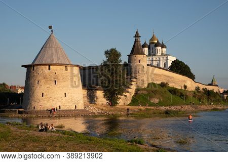Pskov, Russia: August 21, 2020: Pskov Kremlin View From River Pskova Creek. Towers, Wall And Trinity