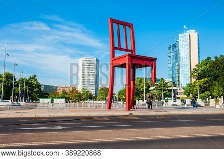 Geneva, Switzerland - July 20, 2019: Broken Chair Or Chaise Cassee Is A Wooden Sculpture By The Swis