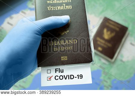 Thailand Passport, Risk-free Certificate Concept. Hand In Blue Medical Gloves Holds Thailand Passpor
