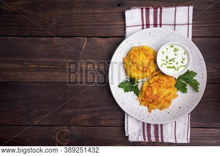 Fried Cakes Of Grated Potatoes On The Plate With Sauce. Traditional Pancakes Boxty Raggmunk.