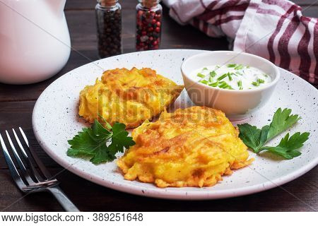Fried Cakes Of Grated Potatoes On The Plate With Sauce. Traditional Pancakes Boxty Raggmunk.