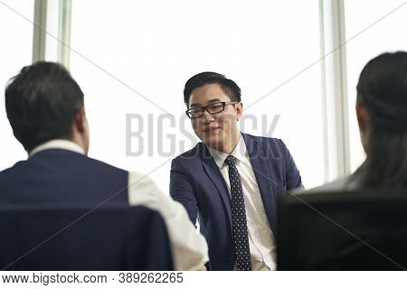 Young Asian Job Seeker Shaking Hands With Human Resources Manager Before Job Interview