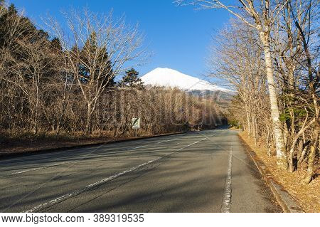 Beautiful View Of Mount Fuji Snow Covered In Winter With White Clouds And Blue Sky. Photo Taken From