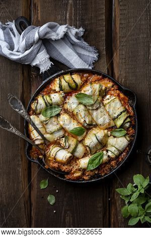 Baked Zucchini Rolls With Ricotta Cheese And Herbs In Meat Ragu Bolognese And Basil