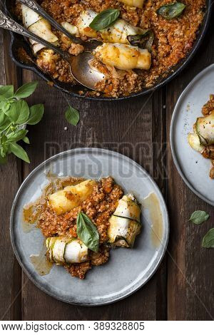 Baked Zucchini Rolls With Ricotta Cheese And Herbs In Meat Ragu Bolognese And Basil