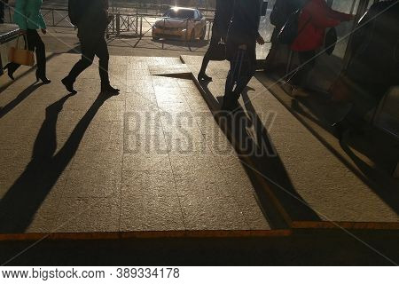 Men And Women In A Hurry To Urban Transport. Morning Chaos In Front Of The Subway. People Walk Past 