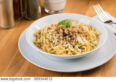 Turkish Noodle / Eriste With Cheese, Walnuts On Wooden Background