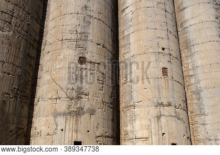 Old Abandoned Industrial Plant. Concrete Silos Background Texture.