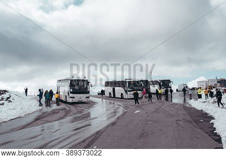 Editorial 09.07.2019 Dalsnibba Norway, Buses And Tourists At The Parking Lot On The Top Of Dalsnibba