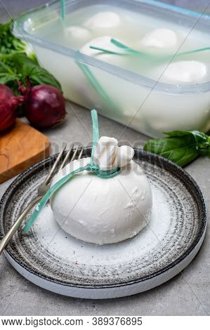 Eating Of Fresh Handmade Soft Italian Cheese From Puglia, White Balls Of Burrata Or Burratina Cheese