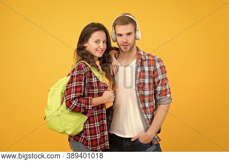 Youth Lead Way In Fashion Ideas. Hipster Couple Students. Fashionable Students Couple Yellow Backgro