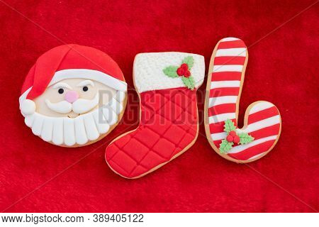 Christmas Cookies With Santa Face On Red Fur Background 