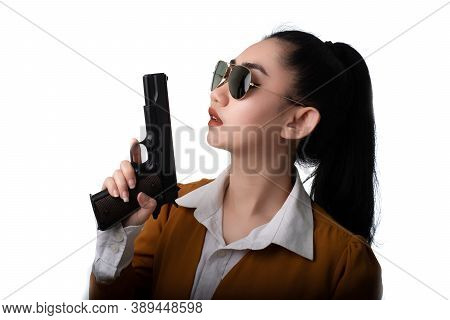 Portrait Beautiful Asia Woman Wearing A Yellow Suit One Hand Holding A Pistol Gun At The White Backg