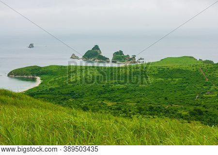 Bay Of The Sea From The Top Of A Hill Of A Mountainous Coast With An Island In The Background, Summe
