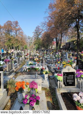 Bytom, Poland - November 1, 2019: People Visit Cemetery During All Saints Day In Bytom. All Saints D