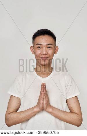 Portrait Of Young Asian Man With Problematic Skin And Hyperpigmentation On His Face Looking At Camer