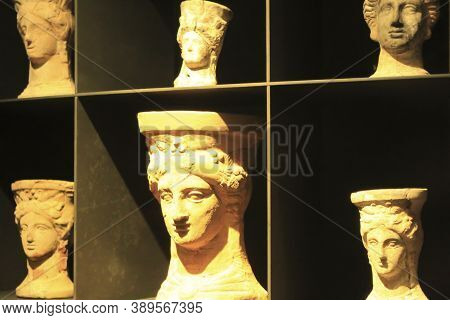 Alicante, Spain- October 8, 2020: Cauldrons Shaped Like Terracotta Female Head Exhibited At The Arch