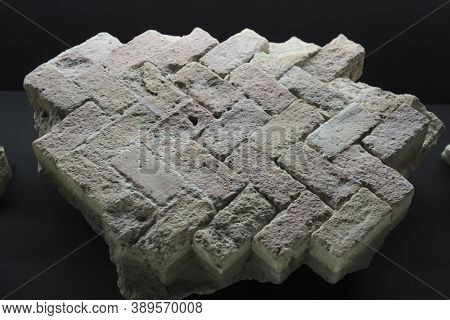 Alicante, Spain- October 8, 2020: Fragments Of The Braided Stone Floor, Cooper Pipe And Round Brick 