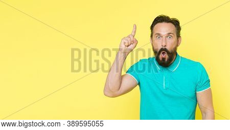 Surprised Man With Open Mouth Keep Finger Pointing Up. Beraded Man Surprised With Epiphany And Sudde
