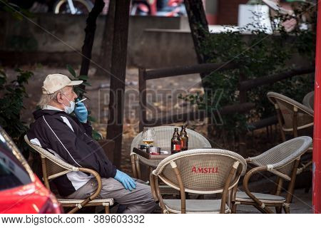 Belgrade, Serbia - October 4, 2020: Old Senior Man Wearing A Respiratory Face Mask Sittting At The T