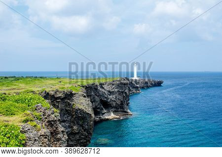 Cape Zanpa Lighthouse, Okinawa, Japan With Surrounding Volcanic Rock Formation
