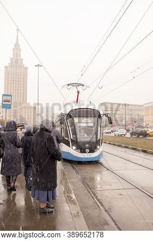 Moscow, Russia - March 22, 2019: The Tram Arrived At The Stop. Passengers Sit In The Tram. Komsomols