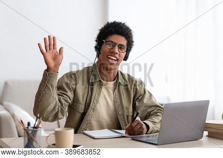 Web-based Communication Concept. Black Teen Guy Talking To His College Tutor On Laptop Computer From