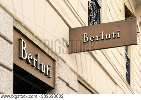 Street Hanging Mounted On The Wall. Signboard For Logo Presentation. Berluti, Part Of The Lvmh Group