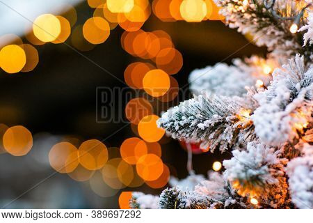 Christmas Winter Street With Tree And Festive Bokeh Lighting, Blurred Holiday Background