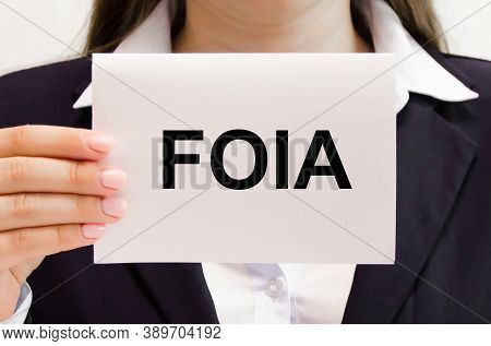 Focused On The Business Concept. The Word Foia Is Written On A White Piece Of Paper. Freedom Of Info
