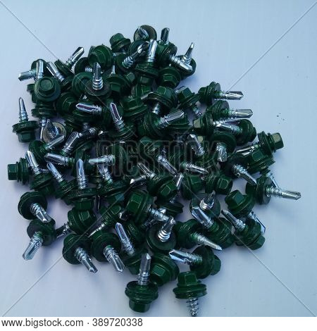 Green Roofing Self Tapping Screws On A Light Background