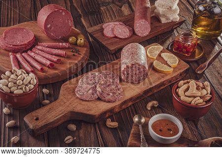 Slices Of White Pudding With Pistachios, Chestnut And Smoked Salami