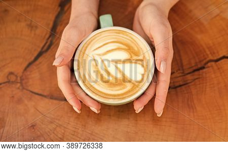 Beautiful Pattern Heart Created By Microfoam. Coffee Shop And Cafe Concept. Female Hands Cappuccino.