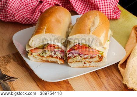 Italian-american Chicken Fried Steak Sandwich Hogie With Shredded Lettuce Tomato Hot Peppers And Red