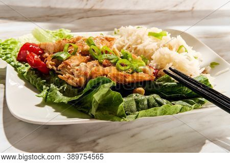 Japanese Chicken Teriyaki Lettuce Wrap Dinner With Rice Peanuts Peppers And Sliced Green Onion