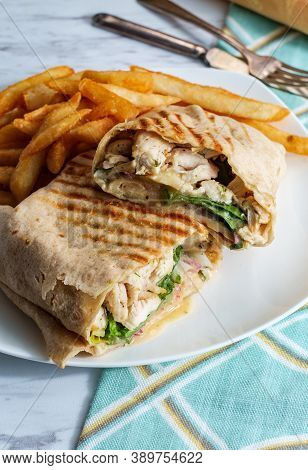 Chicken Caesar Salad Wrap Sandwich With Romaine Lettuce And French Fries