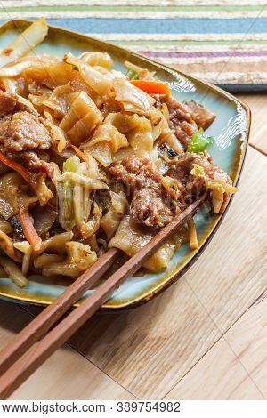 Stir Fried Chinese Beef Chow Fun With Hor Fun Wide Rice Noodles Cabbage And Carrots