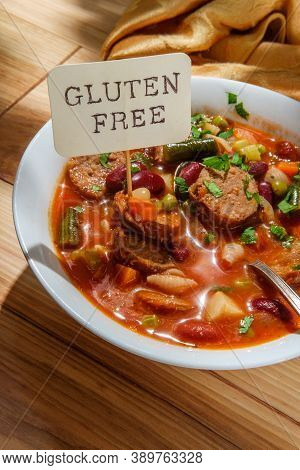 Hearty Italian Minestrone Soup With Sliced Sausage And Vegetables