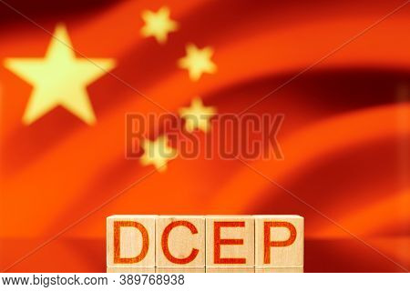 Dcep. Wooden Blocks With The Inscription Dcep On The Background Of The Flag Of China. Digital Yuan C