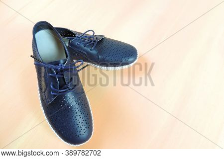 Female Casual Moccasins  Deep Blue Color On Pink Wood Background , Stylish Women`s Slip On Shoe. Sum