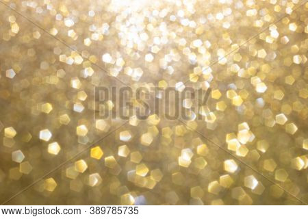 Defocused Abstract Colorful Twinkle Light Background.  Gold Glittery Bright Shimmering Background Us
