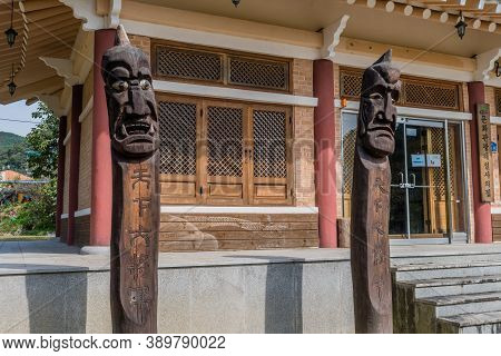 Chilgapsan, South Korea; October 2, 2020: For Editorial Use Only. Two Jangseung Totems In Front Of B